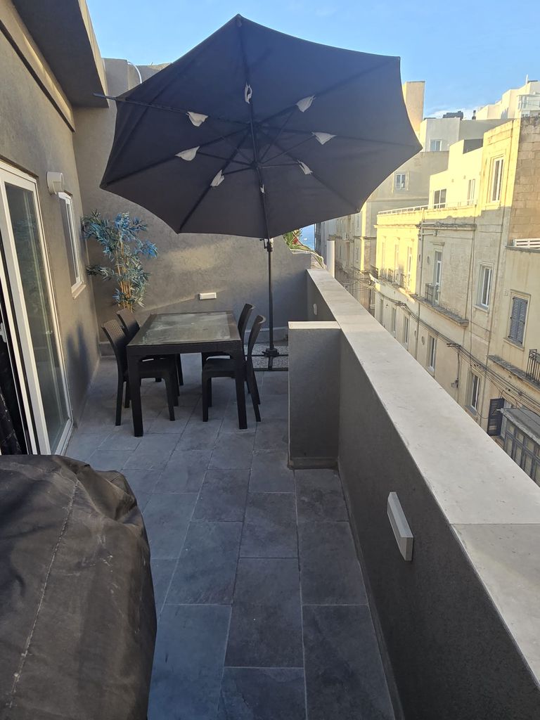 Modern 1-Bedroom Penthouse with Side Sea Views in Sliema